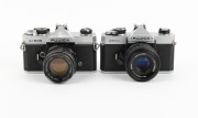 FUJICA: Group of 1970s SLRs, comprising ST605 (Super-Takumar 55mm f1.8), ST701 (Fujinon 55mm f1.8), STX-1 (X-Fujinon 55mm f2.2), and STX-1N (X-Fujinon FM 50mm f1.9). (4 items) - 3