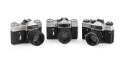 KRASNOGORSK - SWIRLY BOKEH: Group of 1980s SLRs, all fitted with the iconic Helios-44-2 58mm f2 lens, comprising Zenit-E (2) and Zenit ET. (3 items)