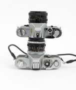 CANON: Pair of 1960s SLRs, comprising Canon FT QL (FL 50mm f1.8, with cap and leather case) and Canon AT-1 (FD 50mm f1.8). (2 items) - 3