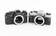 OLYMPUS: Group of 1970s SLRs, comprising Olympus OM-1 (F. Zuiko Auto-S 50mm f1.8, with cap and leather case), Olympus OM10 (body only), and Olympus OM20 (body only). (3 items) - 2