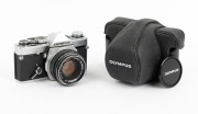 OLYMPUS: Group of 1970s SLRs, comprising Olympus OM-1 (F. Zuiko Auto-S 50mm f1.8, with cap and leather case), Olympus OM10 (body only), and Olympus OM20 (body only). (3 items) - 3