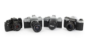 KAMERA-WERKST&Auml;TTEN: Group of 1970s SLRs, comprising Praktica BC1 Electronic (Prakticar 50mm f2.4), Praktica L2 (Fujinon 29-47mm f3.5-4.2), Praktica L3 (Super Albinar MC Auto 28mm f2.8, with cap), and Praktica Super TL (Jena 50mm f2.8). (4 items)
