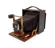 KODAK: "Pony Premo No. 7" folding camera, c. 1902, plate dimensions 11.5 x 17cm, Goerz 210mm lens, pneumatic shutter, red bellows.