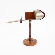 1900 PARIS EXPOSITION UNIVERSELLE: H.C. White Co. handheld stereoscope on stand, with "Exposition Universelle Internationale 1900" logo embossed on metal visor; height 30cm. - 2