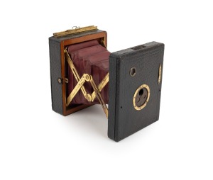 MONROE: "Pocket Monroe A" strut-folding camera, c. 1897, brass fittings, red bellows.