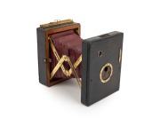 MONROE: "Pocket Monroe A" strut-folding camera, c. 1897, brass fittings, red bellows.