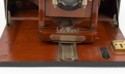 MANHATTAN OPTICAL: "Wizard B" folding camera, c. 1920s, plate dimensions 12 x 17cm, Bausch & Lomb lens and shutter. - 3