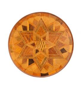 SEUFFERT (New Zealand) table top. Intricately inlaid specimen table top in Anton Seuffert's iconic star patterned design with tumbling box centre. Totara, Puriri, mottled kauri, rewarewa, matai & maire. Later base. Height 78cm, diameter 59cm. RARE