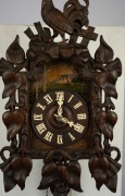 An antique German Black Forest farmhouse wall clock in carved oak case with vine leave decoration and cockerel finial, incised and hand-painted wooden dial plate carved and fretted bone hand. Wood plate 30 hour movement striking the hour and half hour on - 2