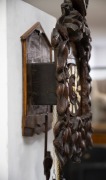 An antique German Black Forest farmhouse wall clock in carved oak case with vine leave decoration and cockerel finial, incised and hand-painted wooden dial plate carved and fretted bone hand. Wood plate 30 hour movement striking the hour and half hour on - 3