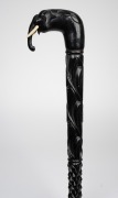 An antique Indian ebony walking stick with carved elephant handle and horn ferrule, 19th century, ​​​​​​​91cm high. - 2