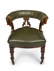 An antique English mahogany framed tub style desk chair with green leather upholstery, circa 1875, ​​​​​​​77cm high, 64cm across the arms.