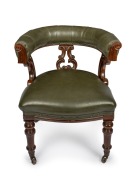 An antique English mahogany framed tub style desk chair with green leather upholstery, circa 1875, ​​​​​​​77cm high, 64cm across the arms.