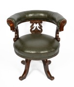 An antique English oak tub style desk chair on revolving base, 19th century, ​​​​​​​76cm high, 68cm across the arms.