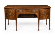 An English Sheraton period bow front mahogany sideboard with rosewood cross banding, ebony and boxwood stringing, and unusual recessed tambor front storage beneath the central drawer, circa 1800, attractive smaller size 84cm high, 168cm wide, 75cm deep.