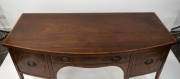 An English Sheraton period bow front mahogany sideboard with rosewood cross banding, ebony and boxwood stringing, and unusual recessed tambor front storage beneath the central drawer, circa 1800, attractive smaller size 84cm high, 168cm wide, 75cm deep. - 2