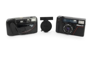 NIPPON KOGAKU: Pair of 1980s plastic point-and-shoot cameras, comprising Nikon L35 AF (with cap) and Nikon RF2. (2 items)