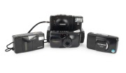 OLYMPUS: Group of 1980s-90s plastic point-and-shoot cameras, comprising Olympus Infinity Junior, Olympus Stylus Zoom 105, Olympus Stylus Zoom DLX (jammed), and Olympus XA-2 (in maker's case). (4 items)