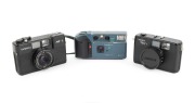 YASHICA: Group of 1980s-90s plastic point-and-shoot cameras, comprising Yashica Kyocera AF-J, Yashica ME1, and Yashica MF-2. (3 items)