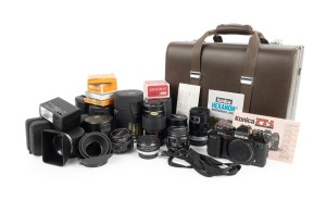 KONICA: FT-1 Motor SLR, c. 1983, in hard case with multiple lenses and accessories.