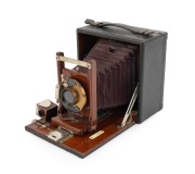 GUNDLACH: Folding camera, c. 1920s, plate dimensions 9.5 x 12cm, Gundlach pneumatic shutter, red bellows, "J.W. Small & Co. Melbourne" retailer's plate.