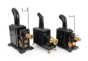 Group of c. 1880s toy magic lanterns, one with Johann Falk manufacturer's plate; black-lacquered tin, the tallest 31cm. (3 items)