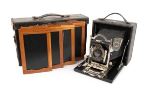 KODAK: "3A Premo No. 9" folding camera, c. 1910s, plate dimensions 14 x 8cm, Bausch & Lomb pneumatic shutter; offered in original matching leather case marked "Premo" on handle, with four slide holders.