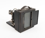 KODAK: "3A Premo No. 9" folding camera, c. 1910s, plate dimensions 14 x 8cm, Bausch & Lomb pneumatic shutter; offered in original matching leather case marked "Premo" on handle, with four slide holders. - 2