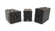 BOX CAMERAS: Circa 1900s group; names include "The Cadet" and "No. 3 Maxim"; the tallest 15cm. (3 items)