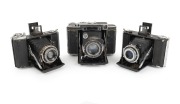 ZEISS IKON: Group of c. 1930s folding cameras, comprising Ikonta 521/16 (Novar 75mm f4.5/Klio), Nettar 515/16 (Novar 75mm f4.5/Pronto), and Super Ikonta 530/16 (Tessar 80mm f2.8/Compur Rapid). (3 items)