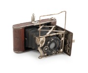 ZEISS IKON: Piccolette 545/12 "Luxus" folding camera, c. 1927, Tessar 75mm f4.5 lens, Compur shutter, brown leather covering.