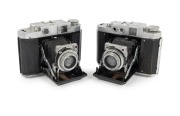 MAMIYA: Pair of c. 1940s Mamiya-Six folding cameras, both with Zuiko 75mm f3.5 lens, one with Seikosha-Rapid shutter, the other with Konan-Rapid shutter.