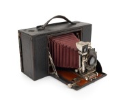 KODAK: No. 4 Screen Focus folding camera, c. 1904, Rapid Rectilinear lens, red bellows, unusual hinged body; one of only approximately 4000 to be manufactured.