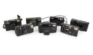 PLASTIC POINT-AND-SHOOT CAMERAS: 1980s-90s group comprising Kodak VR35 K4a, Kodak VR35 K5 (2), Kodak VR35 K12, Kodak S100EF, Minolta FS-E III, and Ricoh Shotmaster Tru-Zoom Date. (7 items)