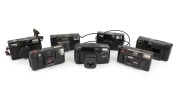 PLASTIC POINT-AND-SHOOT CAMERAS: 1980s-90s group comprising Kodak VR35 K4a, Kodak VR35 K5 (2), Kodak VR35 K12, Kodak S100EF, Minolta FS-E III, and Ricoh Shotmaster Tru-Zoom Date. (7 items)