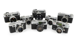 RANGEFINDER CAMERAS: 1960s-70s group comprising Hanimex C35 (2), Konica EE-Matic Deluxe F, Kuribayashi Petri 7, Kuribayashi Petri 1.9, Minolta Hi-Matic 35, and Yashica Electro 35 (2). (8 items)