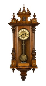 An antique German Vienna regulator style wall clock in walnut case with spring driven time and gong striking movement, circa 1910, 98cm high.