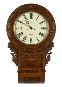 An antique English drop dial wall clock in carved oak case with two train fusee movement and Roman numerals, 19th century, 74cm high.
