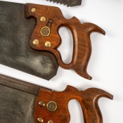 Four assorted hand saws, two spirit levels and a user made marking gauge, 19th/20th century, (7 items). - 2