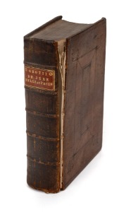 GROTIUS' DE JURE BELLI AC PACIS: 1712 leatherbound Amsterdam edition, gilt title to spine, 946pp. + index, front board detached.