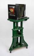 Circa 1920s large format studio camera, plate dimensions 21 x 16.5cm, Taylor Taylor & Hobson Cooke Series II 10 x 8" Eq. Focus brass lens, intact black bellows, on adjustable timber stand; height set to approx. 1.5m. - 2