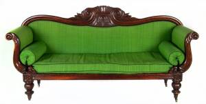 An Australian double-ended cedar sofa, Tasmanian origin, c1840s. Fine outward scrolling arms, ornately carved back & faceted baluster shaped legs. Handsomely upholstered in green cloth, 19th century patina. 73 x 215 x 62cm 