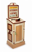 Free-standing coin-operated hardwood stereoscope, "Shajaho Amusements - Stereo Views - One Penny", c. 1920s; loaded with several stereo cards, handle and key present, operates manually with One Penny coin, overall height 1.45m.