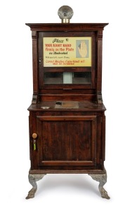 FORTUNE-TELLING MACHINE: "Ahren's London" palm reading machine, oak case, cast-iron claw feet, early-20th century, "Place your right hand firmly on the plate as illustrated - With your left, insert penny. Correct reading of your hand will then be delivere