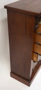 An antique English mahogany Wellington chest of seven graduated drawers with carved corbel decoration, bearing brass maker's plaque "W.H. TRAVERS, Endell St. & Castle St. Long Acre, W.C.", 19th century, 102cm high, 49cm wide, 36cm deep. - 5