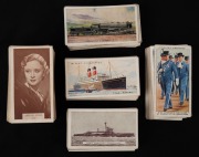 WILLS'S CIGARETTE CARDS: Group of early-20th century sets comprising "Britain's Defenders" [50/50], "Famous Film Stars" [100], "Railway Engines" [50/50], "Merchant Ships of the World" [50/50], together with John Player & Sons "Coronation Series - Ceremoni