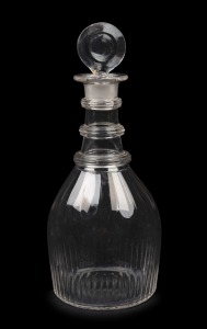 An antique English triple ring crystal decanter with target stopper, circa 1820, unusual small size, 23cm high.
