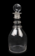 An antique English triple ring crystal decanter with target stopper, circa 1820, unusual small size, 23cm high.