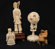 A Chinese carved ivory puzzle ball on stand, a Chinese carved ivory statue of a fisherman, together with two Japanese carved ivory netsuke, early to mid 20th century, (4 items), ​​​​​​​the largest 14cm high. - 2