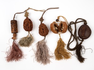 Five assorted Chinese carved nut ornaments and amulets, 20th century.